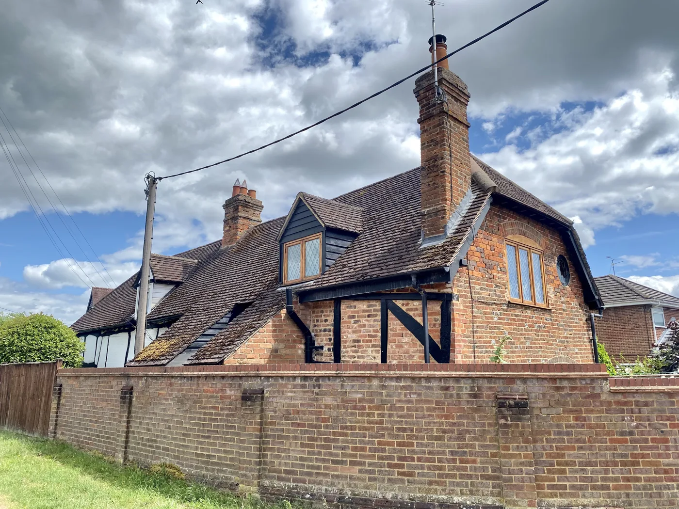 Burcott Lane, Bierton. The 5.3-hectare application site is a field on the west side of this lane; the photograph shows an existing house on the lane, not the site